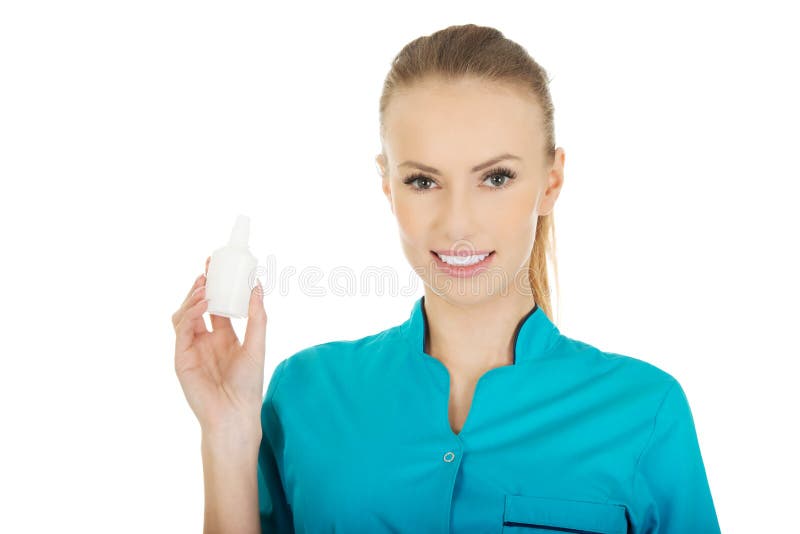 Nurse in uniform holding hydrogen peroxide. Nurse in uniform holding hydrogen peroxide.