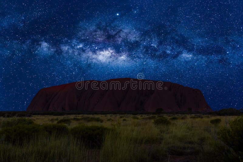 Spectacular Uluru by night with milky way, stars field and galaxies. Uluru-Kata Tjuta National Park in Northern Territory, Central Australia. Spectacular Uluru by night with milky way, stars field and galaxies. Uluru-Kata Tjuta National Park in Northern Territory, Central Australia.