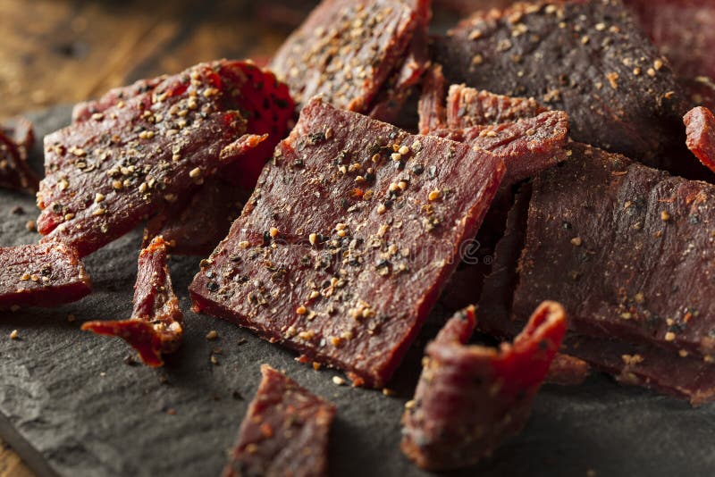 Ξηρό βόειο κρέας Peppered Jerky στοκ φωτογραφία με δικαίωμα ελεύθερης χρήσης Ξηρό βόειο κρέας Peppered Jerky στοκ φωτογραφία με δικαίωμα ελεύθερης χρήσης