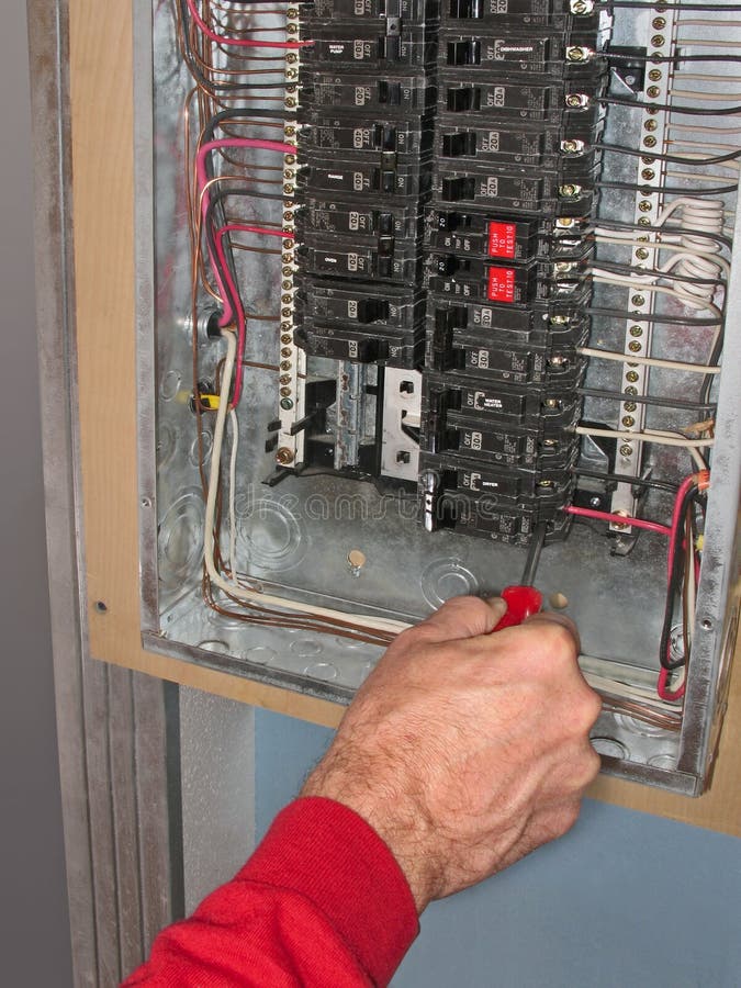 Electrician make connections in residential panel box. Electrician make connections in residential panel box