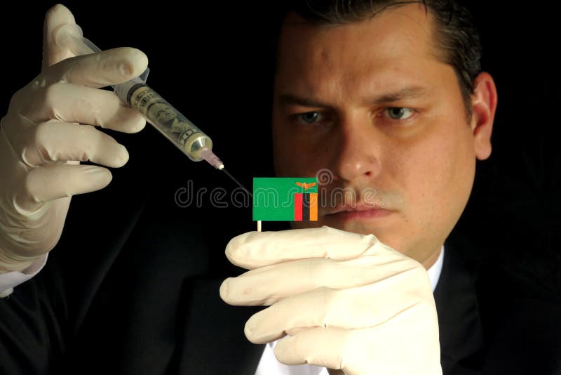 Ο νέος επιχειρηματίας δίνει μια οικονομική έγχυση στην της Ζάμπια σημαία είναι στοκ φωτογραφίες