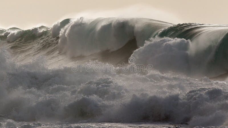 Powerful windswept storm waves batter the northshore of Hawaii biggest winter swell in decades. Powerful windswept storm waves batter the northshore of Hawaii biggest winter swell in decades