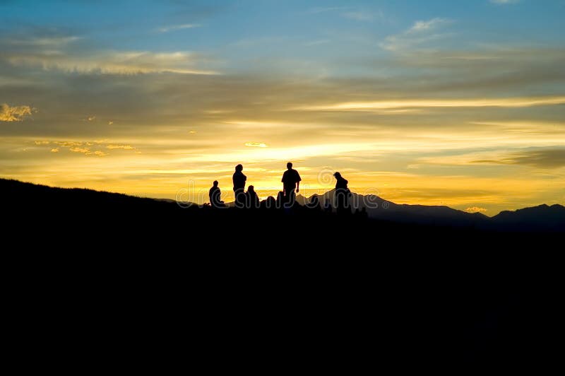 Mountain people silhouette in mountain sunset. Mountain people silhouette in mountain sunset