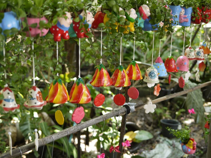 Colorful ceramic wind chimes with natural environment in organic orchid farm with small plants and cartoon decoration. It could be used for decorating, planting, using like a toy, belling, etc. This is a local wisdom and apply the flower pot benefit. It was hang up with a kind of string when air blows around them it makes vibrant sound naturally. Colorful ceramic wind chimes with natural environment in organic orchid farm with small plants and cartoon decoration. It could be used for decorating, planting, using like a toy, belling, etc. This is a local wisdom and apply the flower pot benefit. It was hang up with a kind of string when air blows around them it makes vibrant sound naturally.
