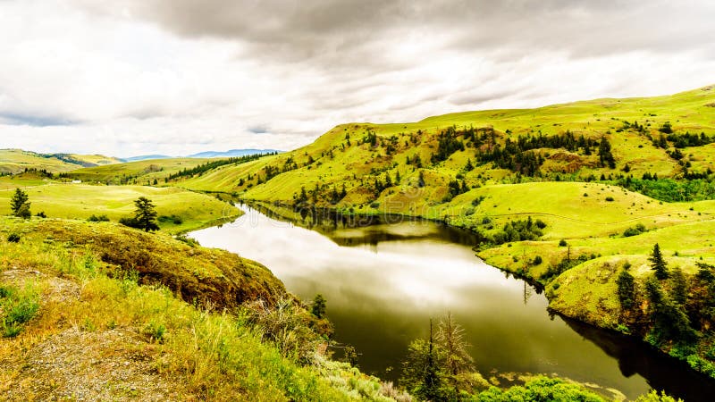 The Rolling Hills and Grasslands under cloudy skies in the Nicola Valley near Merritt British Columbia, Canada. The Rolling Hills and Grasslands under cloudy skies in the Nicola Valley near Merritt British Columbia, Canada