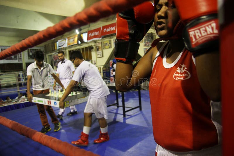 Participants prepare for their next bout of boxing fight after their chess round at the 4th Chess Boxing Championship being held at Boxing Hall, SAI Complex, Salt lake in eastern India city of Kolkata, West bengal. The basic idea in chessboxing is to combine the #1 thinking sport and the #1 fighting sport into a hybrid that demands the most of its competitors â€“ both mentally and physically. Chessboxing was invented by Dutch performance artist, Iepe Rubingh. In India , chessboxing was founded by Montu Das,who opened the Kolkata Chess Boxing Club Kolkata with a demonstration fight in the Bakul Math park in front of 1,500 spectators on 27th of november.nIn a chessboxing fight, two opponents play alternating rounds of chess and boxing. The contest starts with a round of chess, followed by a boxing round, followed by another round of chess and so on.nA contest consists of 11 rounds, 6 rounds of chess, 5 rounds of boxing. A round of chess takes 4 minutes. Each competitor has 12 minutes on the chess timer.nA round of boxing takes 3 minutes. Between the rounds there is a 1 minute pause, during which competitors change their gear. The contest is decided by: checkmate chess round, exceeding the time limit chess round, retirement of an opponent chess or boxing round, KO boxing round, or referee decision boxing round. Participants prepare for their next bout of boxing fight after their chess round at the 4th Chess Boxing Championship being held at Boxing Hall, SAI Complex, Salt lake in eastern India city of Kolkata, West bengal. The basic idea in chessboxing is to combine the #1 thinking sport and the #1 fighting sport into a hybrid that demands the most of its competitors â€“ both mentally and physically. Chessboxing was invented by Dutch performance artist, Iepe Rubingh. In India , chessboxing was founded by Montu Das,who opened the Kolkata Chess Boxing Club Kolkata with a demonstration fight in the Bakul Math park in front of 1,500 spectators on 27th of november.nIn a chessboxing fight, two opponents play alternating rounds of chess and boxing. The contest starts with a round of chess, followed by a boxing round, followed by another round of chess and so on.nA contest consists of 11 rounds, 6 rounds of chess, 5 rounds of boxing. A round of chess takes 4 minutes. Each competitor has 12 minutes on the chess timer.nA round of boxing takes 3 minutes. Between the rounds there is a 1 minute pause, during which competitors change their gear. The contest is decided by: checkmate chess round, exceeding the time limit chess round, retirement of an opponent chess or boxing round, KO boxing round, or referee decision boxing round.