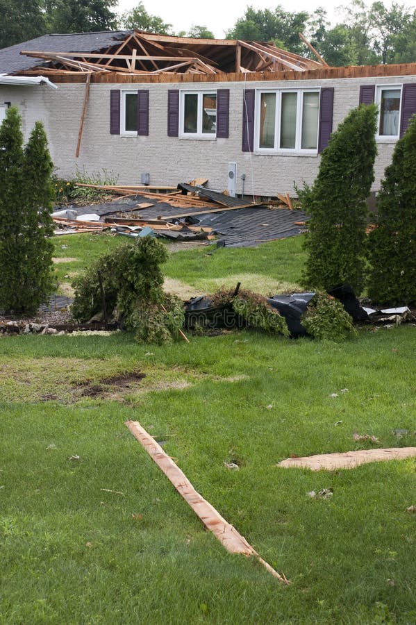 Tornado wind and storm wreaks severe damage onto a residential family home. The structure is damaged beyond repair and will need to be rebuilt. Roof gapes open and the dwelling is knocked off its foundation. We can only hope the people living here had insurance for their house. Disaster relief was delivered quickly to the people in the neighborhood. High winds from a hurricane cause similar devastation. Tornado wind and storm wreaks severe damage onto a residential family home. The structure is damaged beyond repair and will need to be rebuilt. Roof gapes open and the dwelling is knocked off its foundation. We can only hope the people living here had insurance for their house. Disaster relief was delivered quickly to the people in the neighborhood. High winds from a hurricane cause similar devastation.