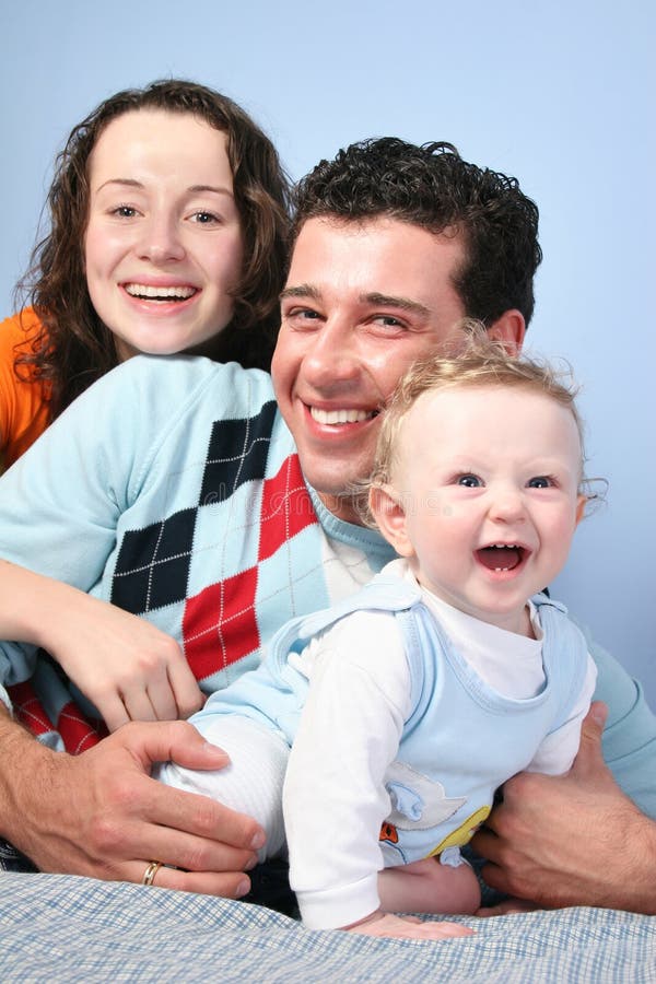 Family with baby on the blue background. Family with baby on the blue background