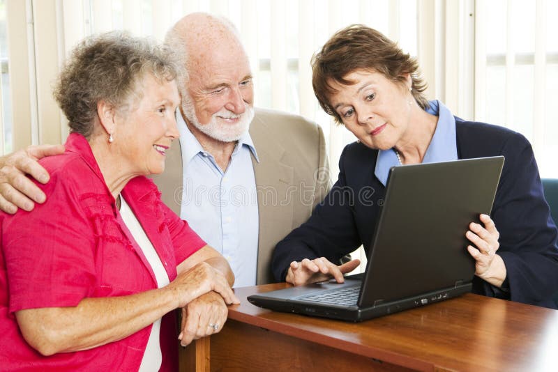 Senior couple getting financial advice or a sales pitch. Senior couple getting financial advice or a sales pitch.