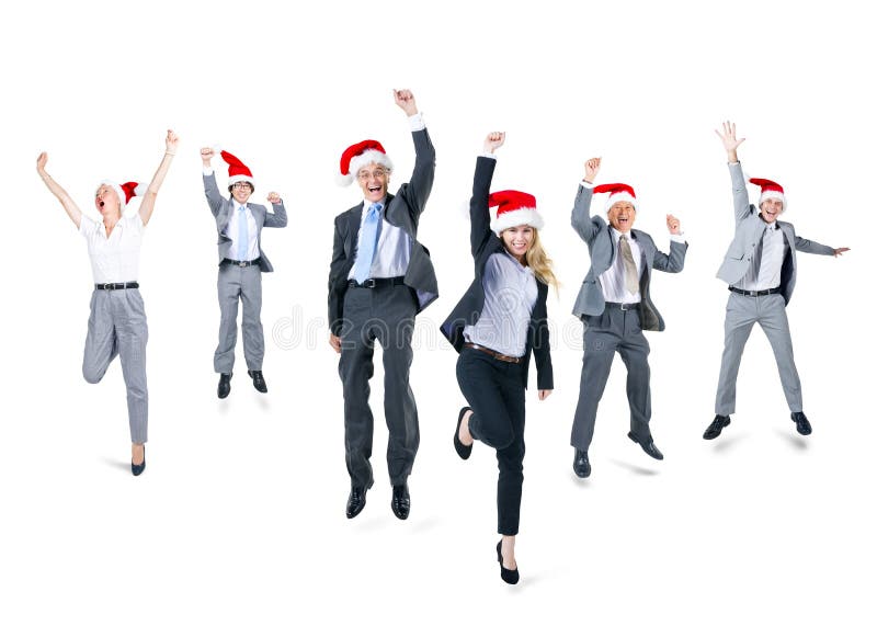 Ομάδα επιχειρηματιών που φορούν τα καπέλα Santa στοκ φωτογραφία