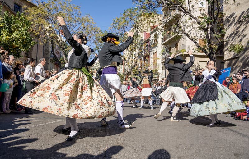 VALENCIA, SPAIN - NOVEMBER 6, 2016. Group of dancers perform a traditional dance on Plaza del Mercado Placa del Mercat,Valencia,at 100 years since the founding of the central market. VALENCIA, SPAIN - NOVEMBER 6, 2016. Group of dancers perform a traditional dance on Plaza del Mercado Placa del Mercat,Valencia,at 100 years since the founding of the central market.