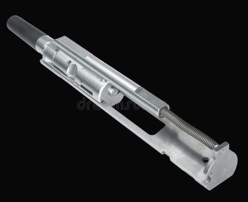 Bolt carrier group isolated with chamber side protected by a rubber cover that is used to convert an AR-15 to shooting .22 long rifle ammunition.on a black background. Bolt carrier group isolated with chamber side protected by a rubber cover that is used to convert an AR-15 to shooting .22 long rifle ammunition.on a black background