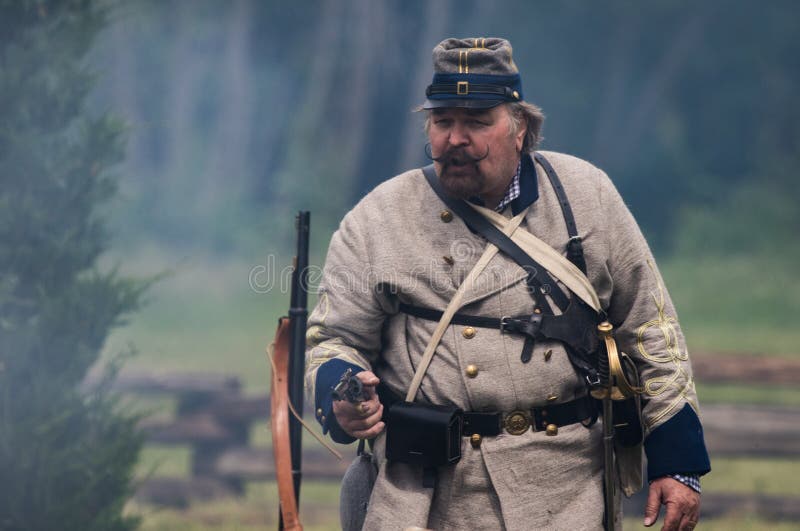 Civil War era soldiers in battle at the Dog Island reenactment in Red Bluff, California. Civil War era soldiers in battle at the Dog Island reenactment in Red Bluff, California.