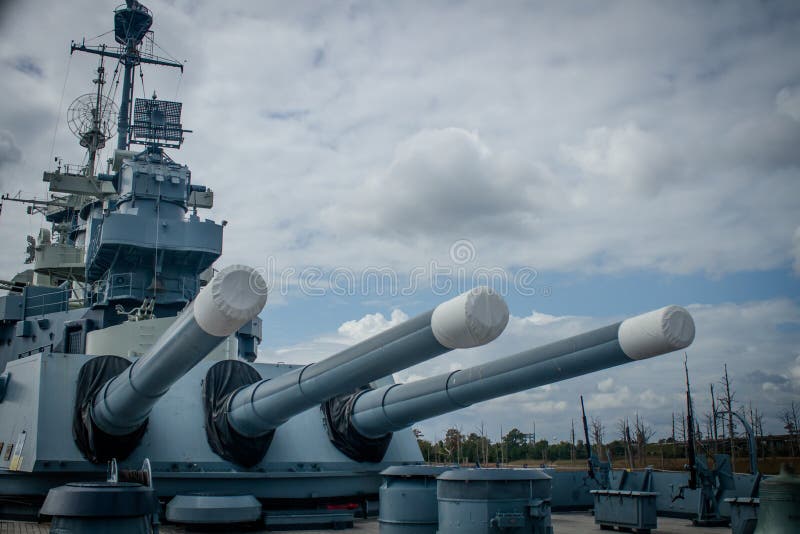 The large aft artillery on the USS North Carolina battleship, moored along the Cape Fear River, in Wilmington, NC, USA. The large aft artillery on the USS North Carolina battleship, moored along the Cape Fear River, in Wilmington, NC, USA.