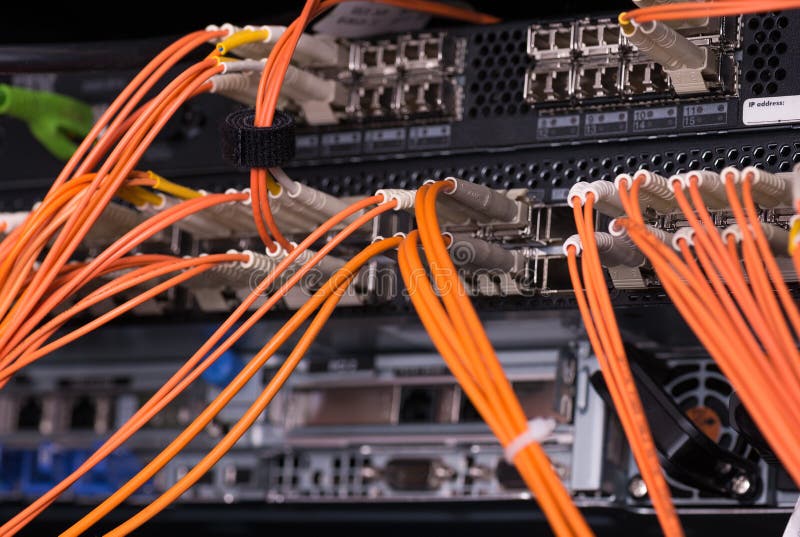 Fiber optical connections with servers, orange cables. Fiber optical connections with servers, orange cables