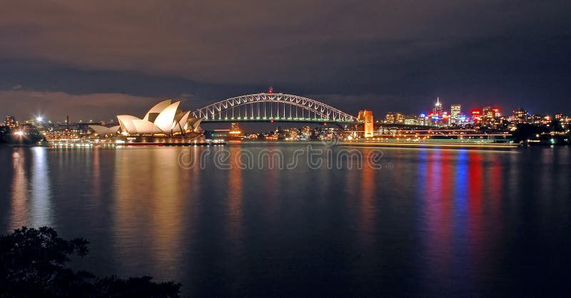 Opera house, harbour bridge and north sydney at night; photo taken from royal botanic gardens. Opera house, harbour bridge and north sydney at night; photo taken from royal botanic gardens