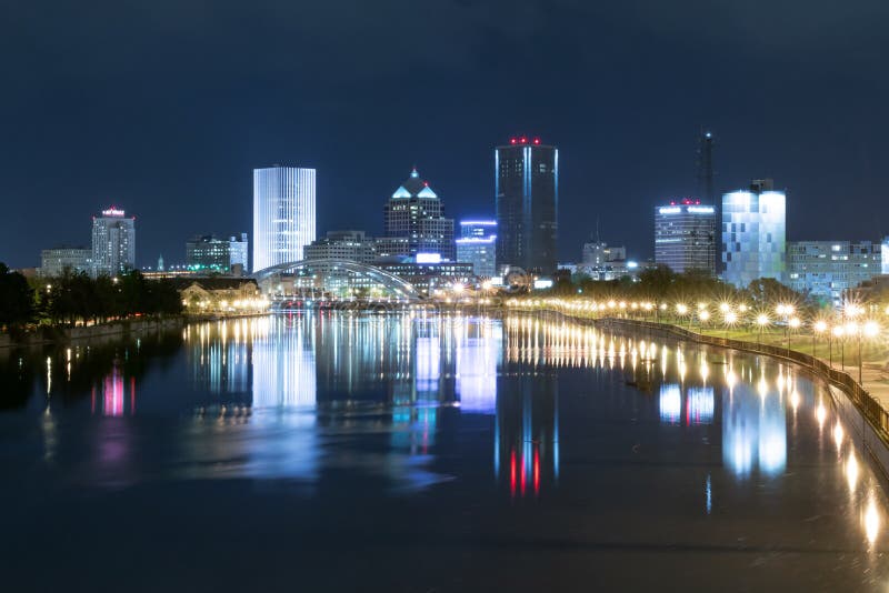 ROCHESTER, NY - MAY 14, 2018: Skyline of Rochester, New York along Genesee River at night. ROCHESTER, NY - MAY 14, 2018: Skyline of Rochester, New York along Genesee River at night