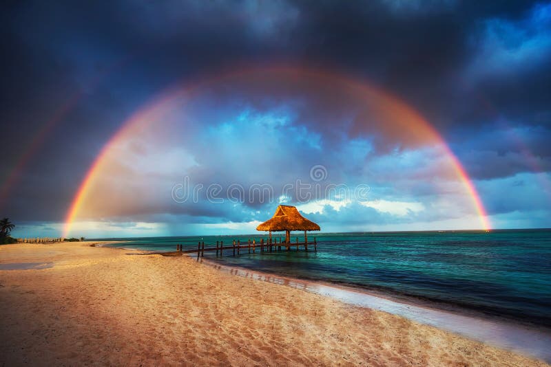 Rainbow over the Wooden Water Villa in Cap Cana, Dominican Republic. Rainbow over the Wooden Water Villa in Cap Cana, Dominican Republic.