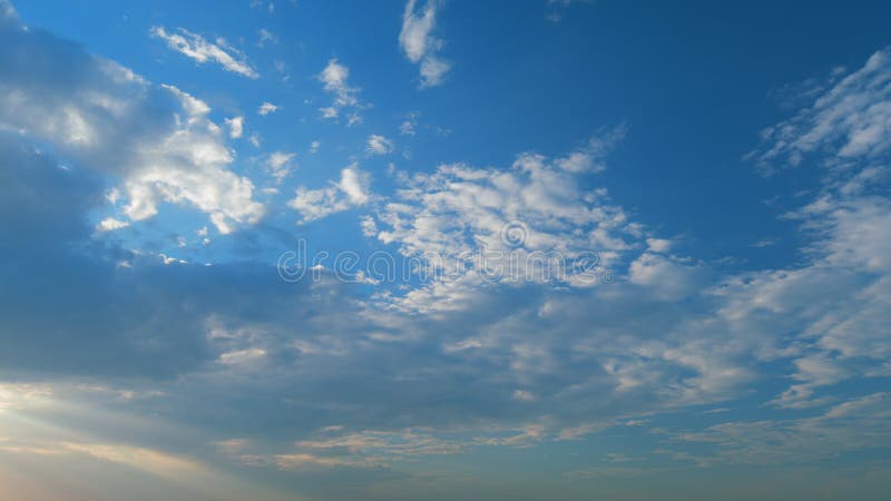 Timelapse. Sky with cirrocumulus clouds weather nature cloud. Cirrocumulus fine clouds texture on blue sunset sky. Timelapse. Sky with cirrocumulus clouds weather nature cloud. Cirrocumulus fine clouds texture on blue sunset sky.