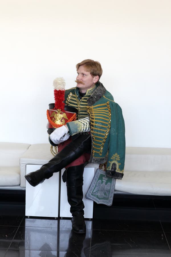 The russian hussar sitting on the couch. The russian hussar sitting on the couch
