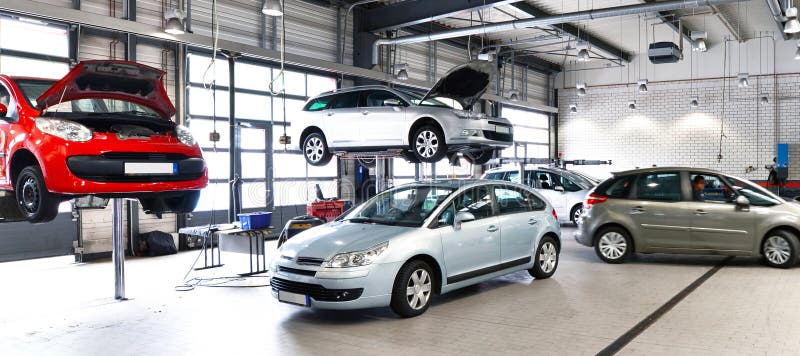 Vehicles in a car repair shop for the repair with lifting platform. Vehicles in a car repair shop for the repair with lifting platform