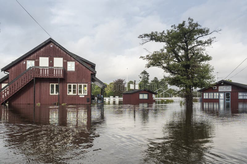 ARENDAL, NORWAY - September 17, 2015: Flooding from the river Nidelv in Arendal, Norway on September 17, 2015. ARENDAL, NORWAY - September 17, 2015: Flooding from the river Nidelv in Arendal, Norway on September 17, 2015.