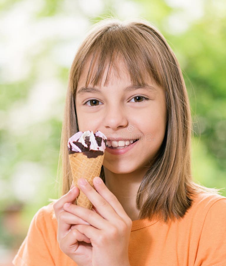 Outdoor portrait of happy girl 10-11 year old with ice cream cone. Outdoor portrait of happy girl 10-11 year old with ice cream cone