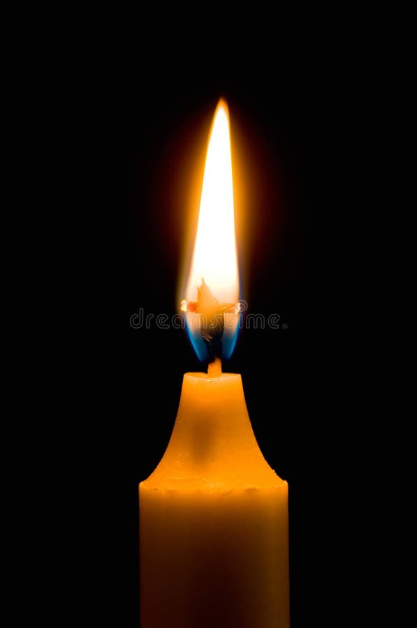 Flaming candle with dark background and cross wick. Flaming candle with dark background and cross wick