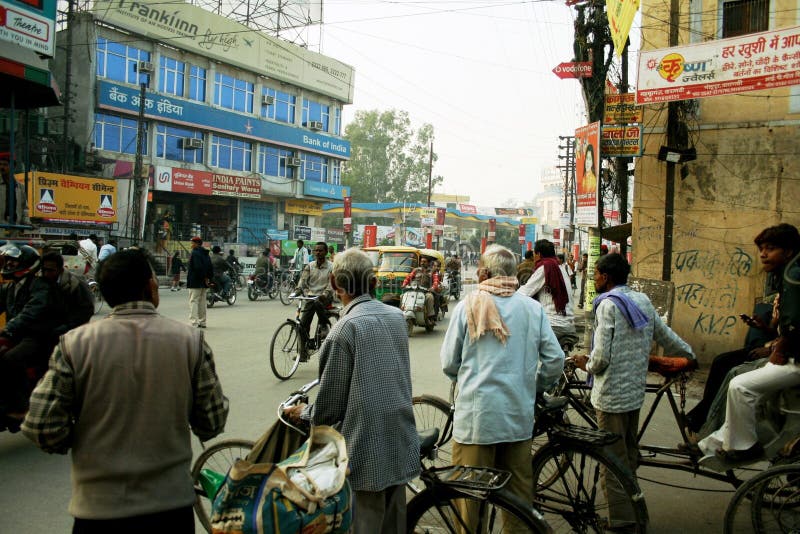 Indian men are waiting to cross the street. Photo was taken in Varanasi, Uttar Pradesh. Indian men are waiting to cross the street. Photo was taken in Varanasi, Uttar Pradesh.