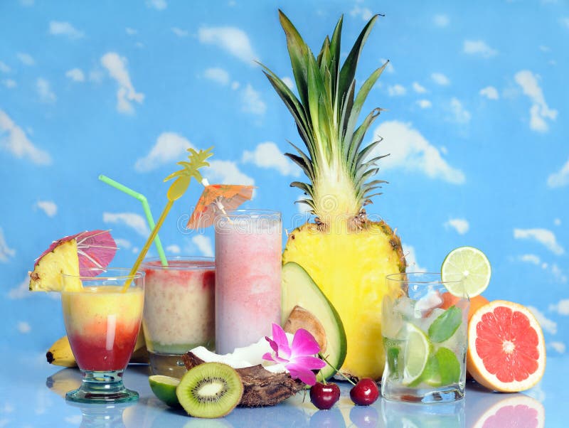 Glasses with drinks and tropical fruits. Glasses with drinks and tropical fruits