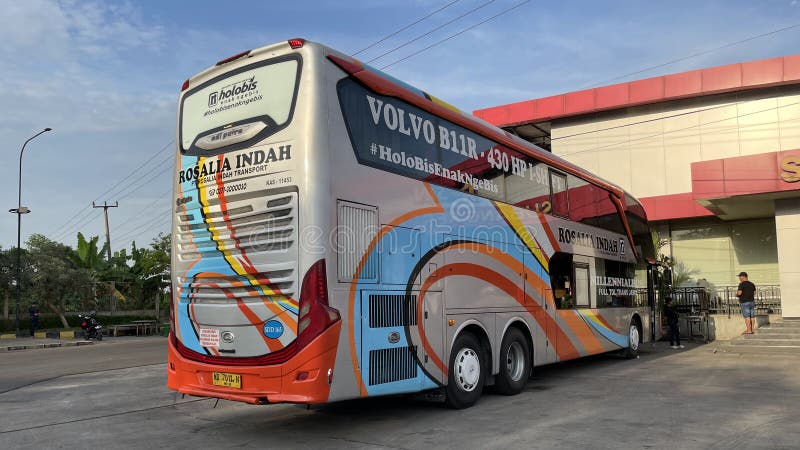 West Java, Indonesia, July 20 2023, Back and side view of a Row of Buses (Rosalia Indah) in the Subang Rest Area, West Java, Rosalia Indah Bus is one of the bus fleets that has its own rest area and covers various travel routes between cities and provinces in Indonesia. West Java, Indonesia, July 20 2023, Back and side view of a Row of Buses (Rosalia Indah) in the Subang Rest Area, West Java, Rosalia Indah Bus is one of the bus fleets that has its own rest area and covers various travel routes between cities and provinces in Indonesia