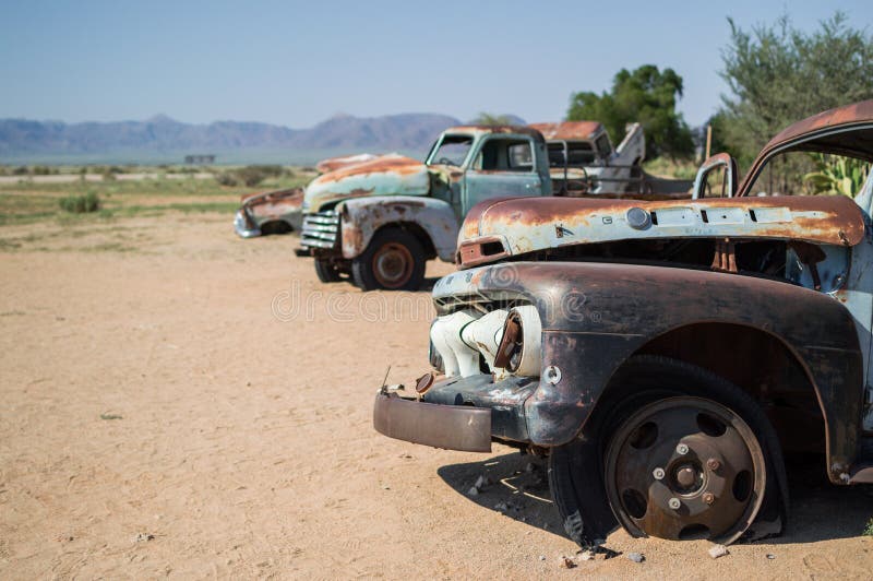 Old Timer Car Wrecks in a Desert Landscape in Solitaire in Namibia. Old Timer Car Wrecks in a Desert Landscape in Solitaire in Namibia