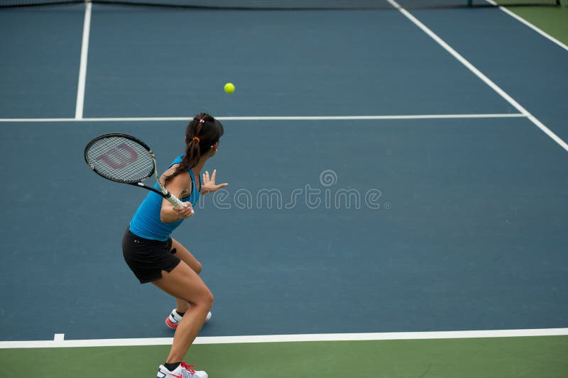 BANGKOK,THAILAND-NOV.29 : Hong Kong tennis player Wing-Yau Venise Chan takes her forehand during her semi final in Chang ITF Pro Circuit 2012 on November 29,2012 At Rama Garden Hotel in Bangkok,Thailand. BANGKOK,THAILAND-NOV.29 : Hong Kong tennis player Wing-Yau Venise Chan takes her forehand during her semi final in Chang ITF Pro Circuit 2012 on November 29,2012 At Rama Garden Hotel in Bangkok,Thailand.