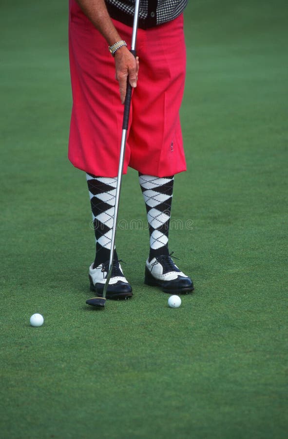 Golfer wearing argyle socks and pink golf pants, Ojai, California. Golfer wearing argyle socks and pink golf pants, Ojai, California