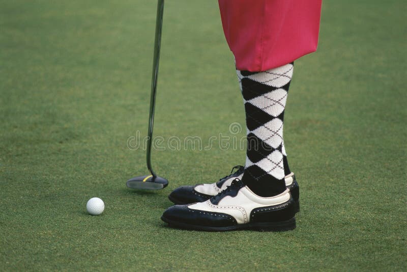 Golfer wearing argyle socks and pink golf pants, Ojai, California. Golfer wearing argyle socks and pink golf pants, Ojai, California