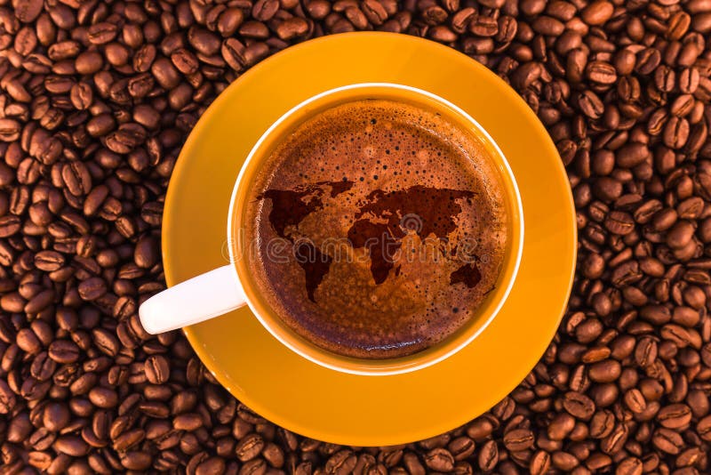 World map on fresh espresso with a beautiful crema and strewn mediumly roasted coffee beans. World map on fresh espresso with a beautiful crema and strewn mediumly roasted coffee beans