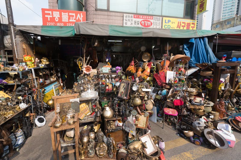 SEOUL - MARCH 25, 2017: The flea market by the Dongdaemun Design Plaza DDP, the centerpiece of South Korea`s fashion hub and popular tourist destination. SEOUL - MARCH 25, 2017: The flea market by the Dongdaemun Design Plaza DDP, the centerpiece of South Korea`s fashion hub and popular tourist destination.