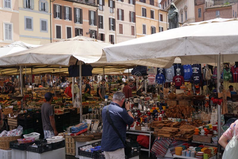 Rome, Italy - June 11, 2018: Campo de` Fiori flea market. The picturesque open air market in Campo de` Fiori is undeniably one of Rome`s most famous. Rome, Italy - June 11, 2018: Campo de` Fiori flea market. The picturesque open air market in Campo de` Fiori is undeniably one of Rome`s most famous