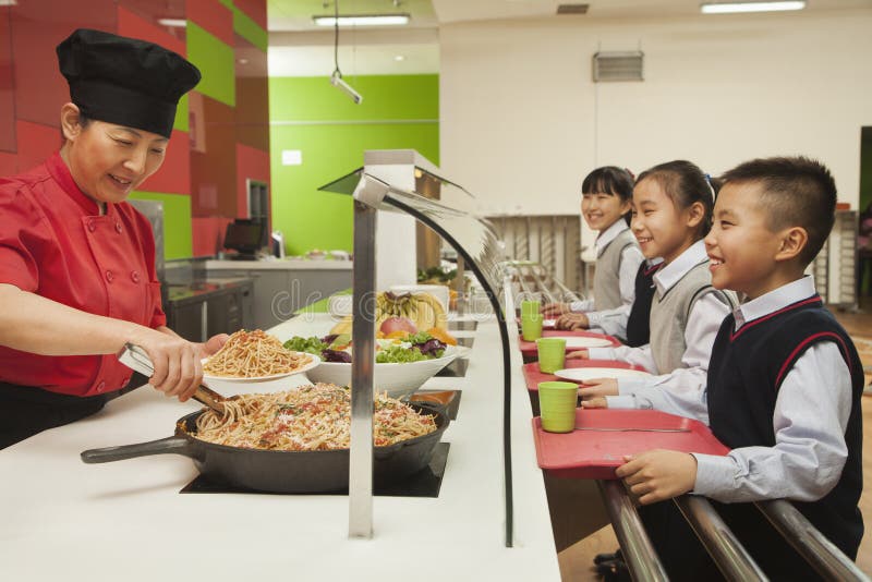 School children standing in line in school cafeteria. School children standing in line in school cafeteria