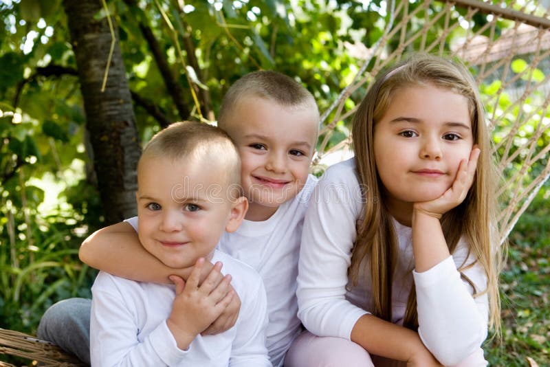 Happy children embracing, family photo. Happy children embracing, family photo