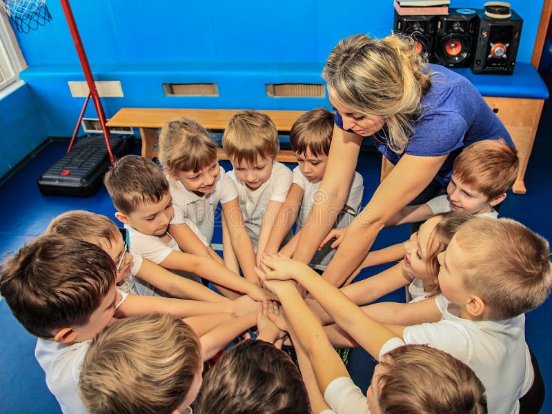 Children up to seven years with a coach are set to play before a sports competition. Children up to seven years with a coach are set to play before a sports competition.