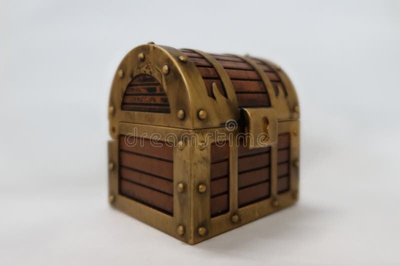 A picture of a toy of a locked treasure chest of pirates. A picture of a toy of a locked treasure chest of pirates.