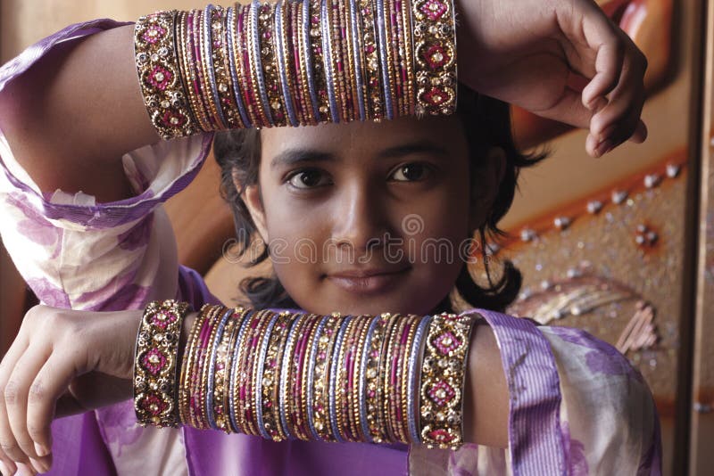 Teenage girl showing tradition bridal bangles. Teenage girl showing tradition bridal bangles