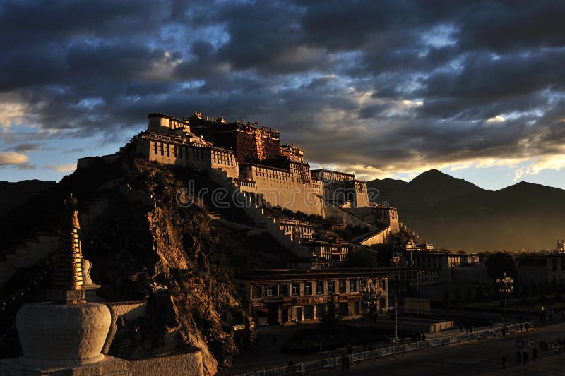 The Potala Palace illuminated by the first rays of the morning sun in Lhasa, Tibet, China. The Potala Palace illuminated by the first rays of the morning sun in Lhasa, Tibet, China