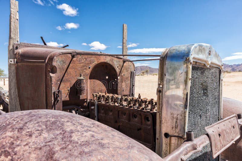 Old and abandoned car engine in the Namibia desert, spot known as solitaire. Africa. Old and abandoned car engine in the Namibia desert, spot known as solitaire. Africa