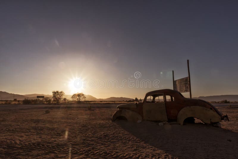 Old and abandoned car in the desert of Namibia. Solitaire. With the beautiful light of the sunrise. Africa. Old and abandoned car in the desert of Namibia. Solitaire. With the beautiful light of the sunrise. Africa