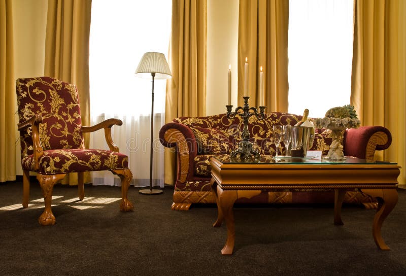 A view of beautiful matching antique furniture in a luxury hotel room. A view of beautiful matching antique furniture in a luxury hotel room.