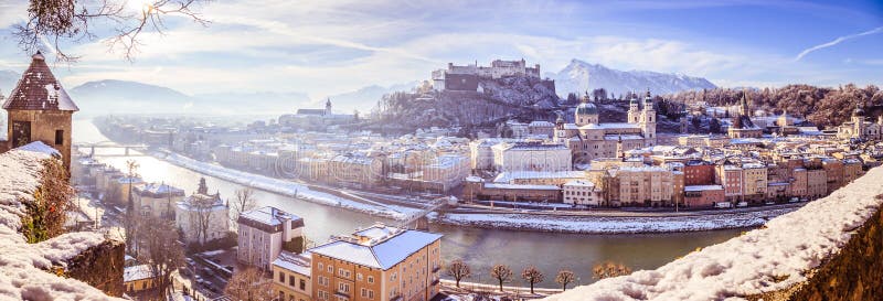 Salzburg historic district at Christmas time, snowy rooftops with sunshine, Austria, magic, advent, alps, city, landscape, austrian, castle, sightseeing, old, postcard, idyll, day, building, winter, cathedral, baroque, church, medieval, europe, evening, fortress, holiday, trip, dusk, landmark, light, mountain, sunlight, beautiful, lights, skyline, tourism, town, travel, unesco, vacation, view, hohensalzburg, river, salzach. Salzburg historic district at Christmas time, snowy rooftops with sunshine, Austria, magic, advent, alps, city, landscape, austrian, castle, sightseeing, old, postcard, idyll, day, building, winter, cathedral, baroque, church, medieval, europe, evening, fortress, holiday, trip, dusk, landmark, light, mountain, sunlight, beautiful, lights, skyline, tourism, town, travel, unesco, vacation, view, hohensalzburg, river, salzach