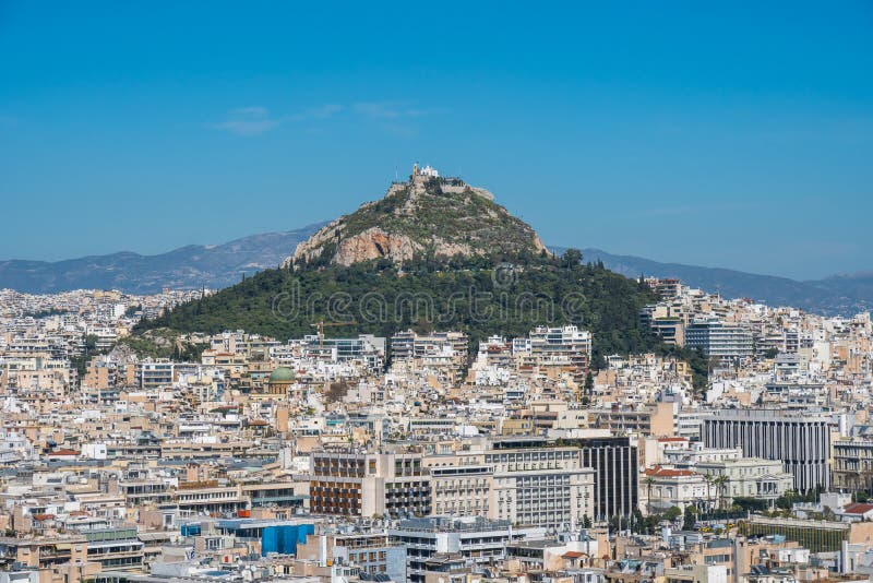 Πανοραμική άποψη της Αθήνας από το λόφο ακρόπολη, ηλιόλουστη ημέρα στοκ εικόνες με δικαίωμα ελεύθερης χρήσης Πανοραμική άποψη της Αθήνας από το λόφο ακρόπολη, ηλιόλουστη ημέρα στοκ εικόνες με δικαίωμα ελεύθερης χρήσης