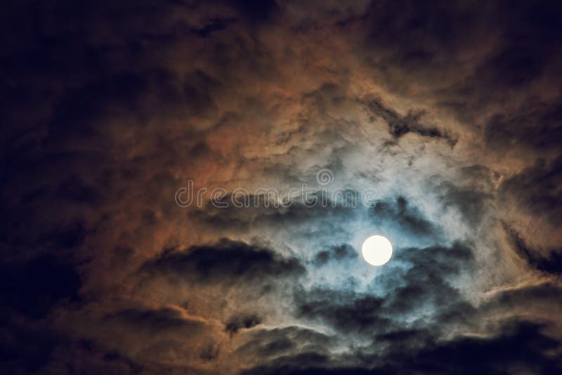 Full moon and cloudy sky, mysterious night atmosphere, fantasy and mysterious moonlight concept, copy space. Full moon and cloudy sky, mysterious night atmosphere, fantasy and mysterious moonlight concept, copy space.